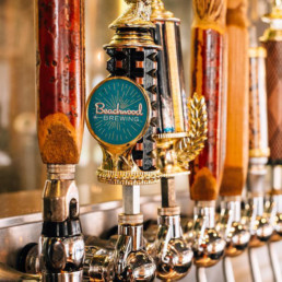 Multiple taps of Beachwood Brewing beers all lined up together